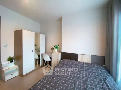 Modern bedroom with stylish decor and ample natural light