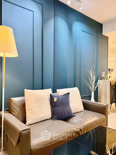 Stylish living room with modern decor and elegant blue accent wall