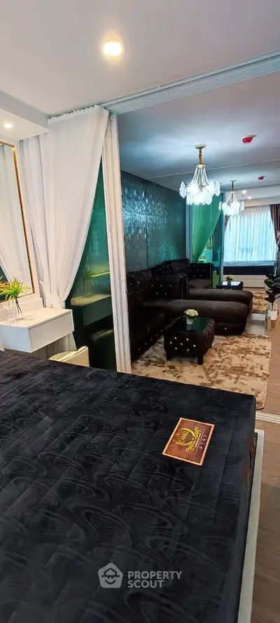 Luxurious living room with elegant decor and plush seating in a modern apartment.