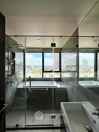 Luxurious bathroom with stunning city view and modern glass shower enclosure.