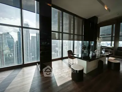 Luxurious high-rise apartment with stunning city skyline views and modern interior design.