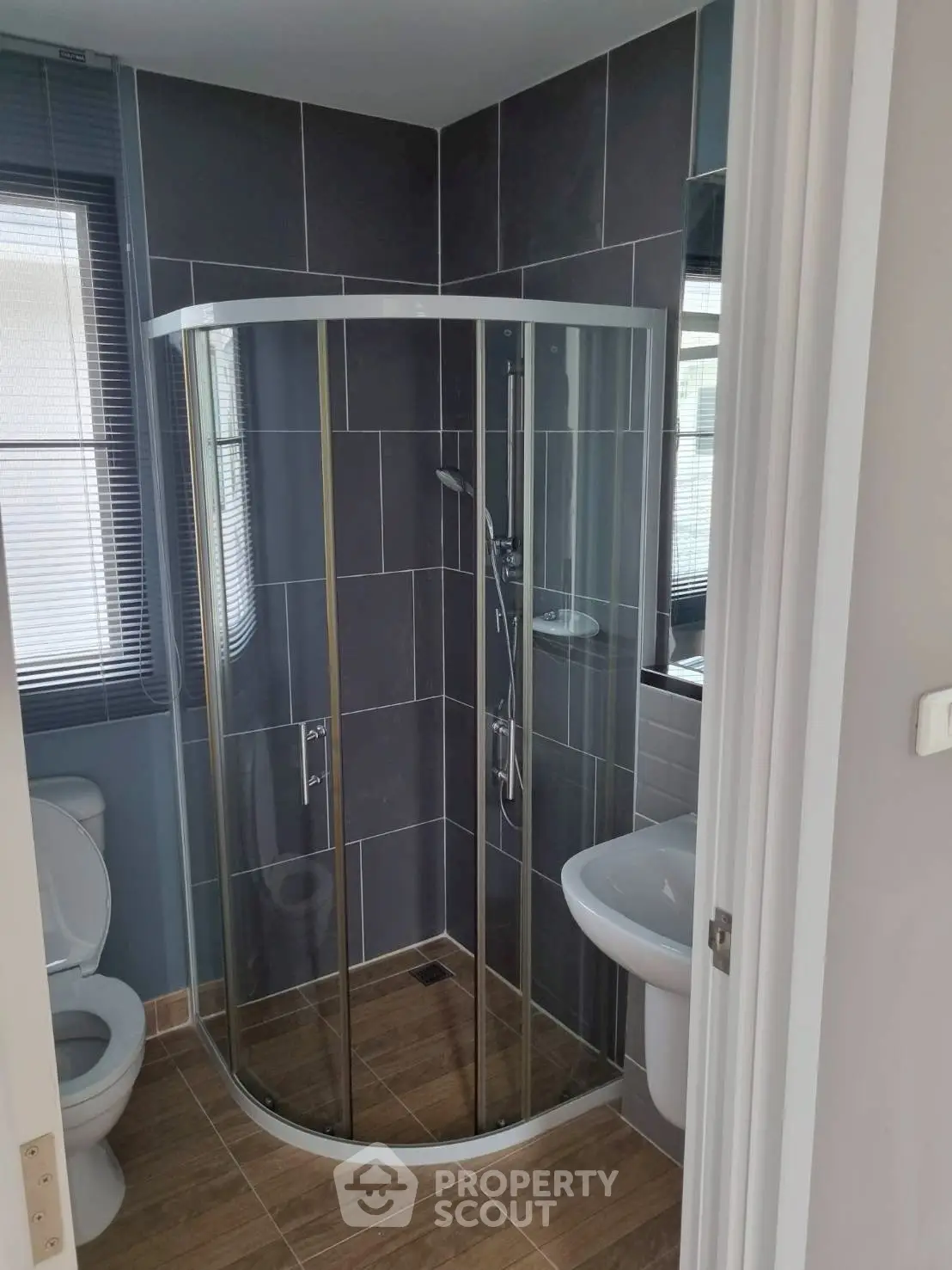 Modern bathroom with glass shower and sleek tile design