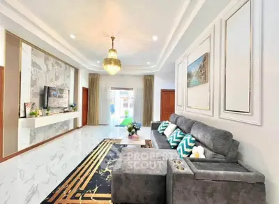 Luxurious living room with elegant chandelier and modern decor