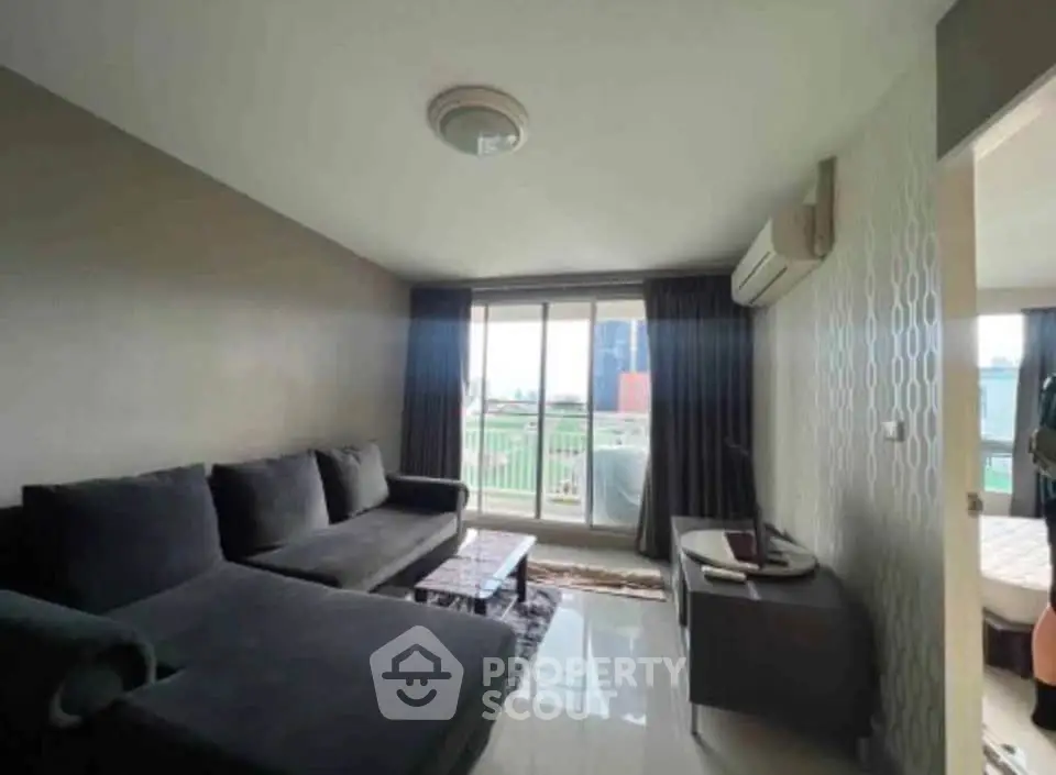 Modern living room with large windows and stylish furniture