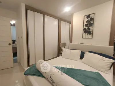 Modern bedroom with stylish decor and ample closet space