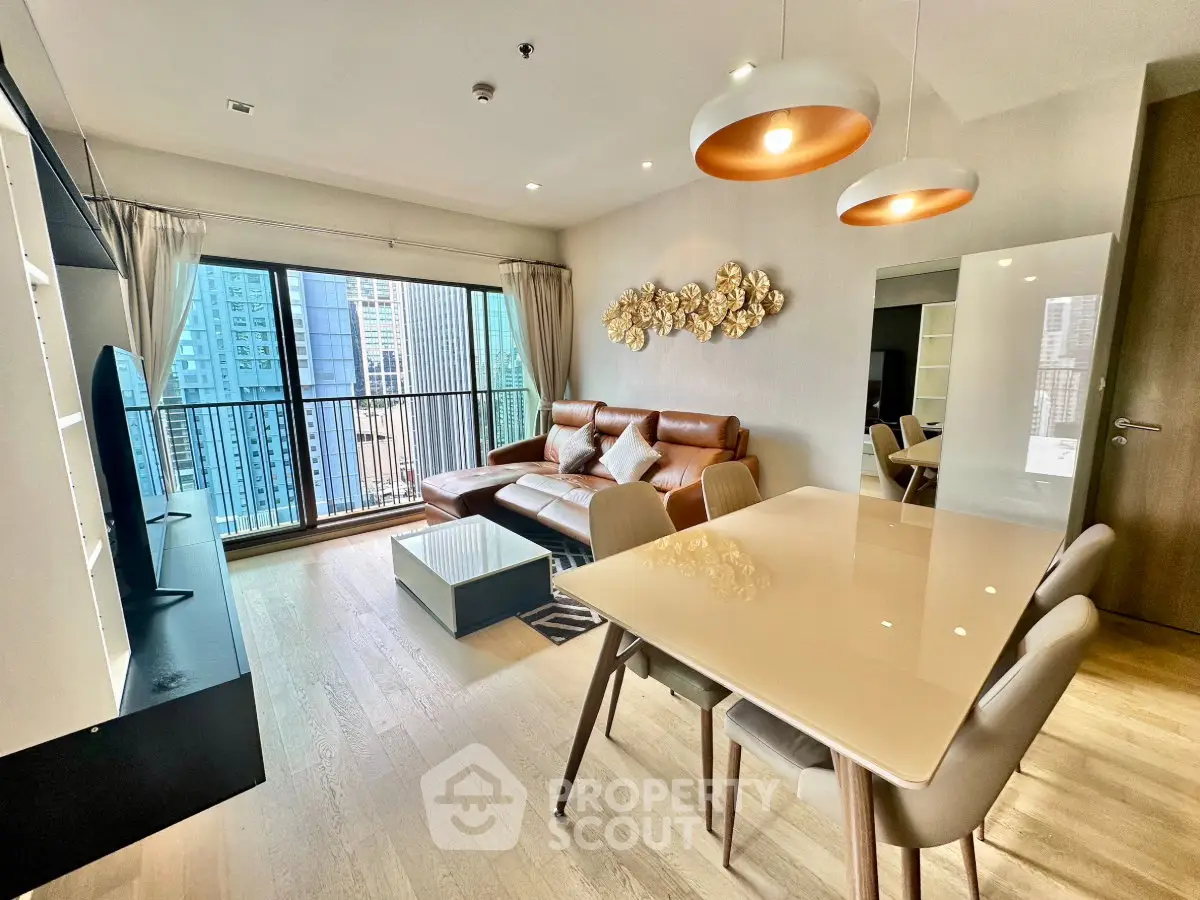 Modern living room with city view, stylish furniture, and elegant lighting in a high-rise apartment.