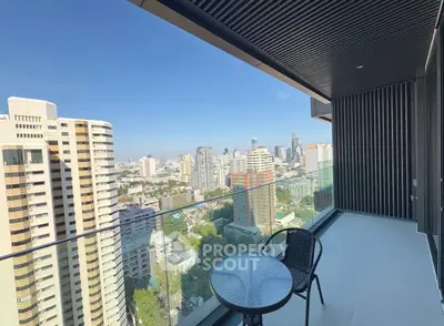 Stunning high-rise balcony with panoramic city views and modern outdoor seating.