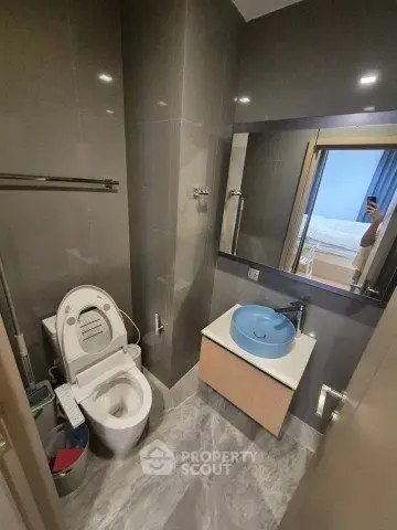 Modern bathroom with sleek design and contemporary fixtures in a stylish apartment.