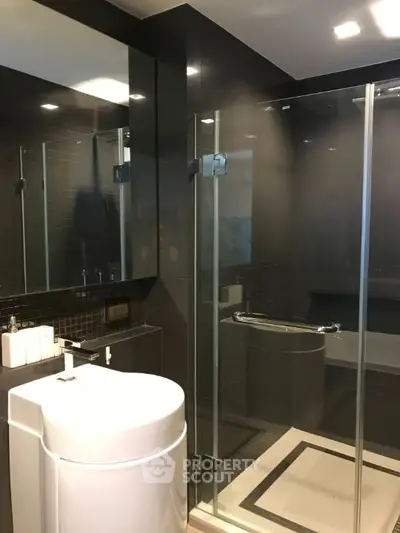 Modern bathroom with sleek glass shower and contemporary fixtures