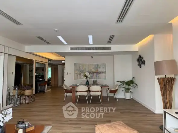 Spacious modern living room with elegant dining area and stylish decor