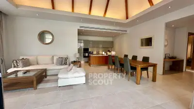 Spacious open-plan living and dining area with modern decor and high ceilings.