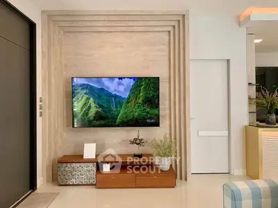 Modern living room with wall-mounted TV and stylish decor