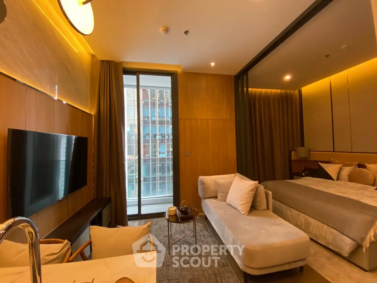 Luxurious modern studio apartment with elegant decor and city view, featuring a cozy living area and stylish bedroom.
