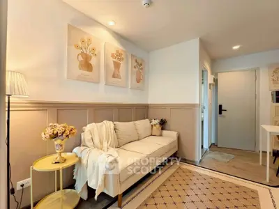 Charming living room with cozy sofa, elegant decor, and warm lighting in modern apartment.