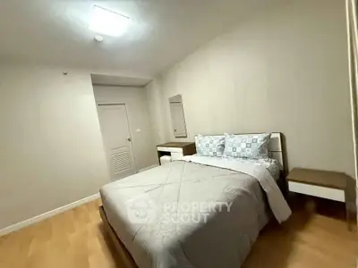 Cozy bedroom with modern decor and comfortable bedding in a stylish apartment.