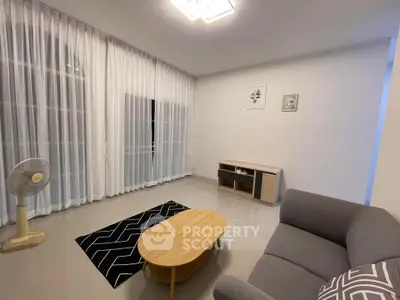 Spacious modern living room with elegant decor and natural light