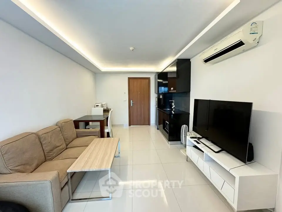 Modern living room with sleek furniture and built-in air conditioning, perfect for contemporary urban living.