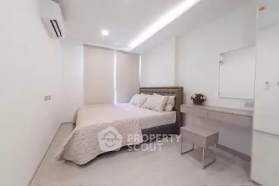 Modern minimalist bedroom with sleek design and natural light
