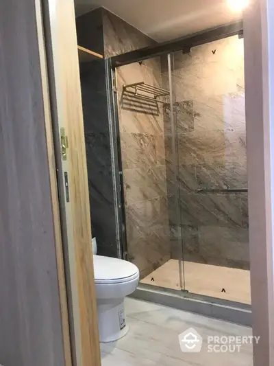 Modern bathroom with glass shower enclosure and sleek design