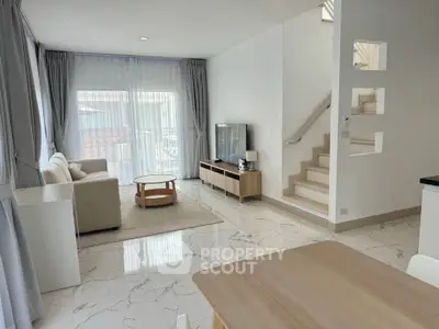 Spacious modern living room with elegant decor and natural light