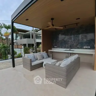 Luxurious outdoor patio with modern seating and stylish design, perfect for relaxation and entertaining.
