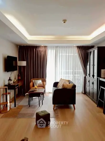 Spacious living room with modern decor and natural light