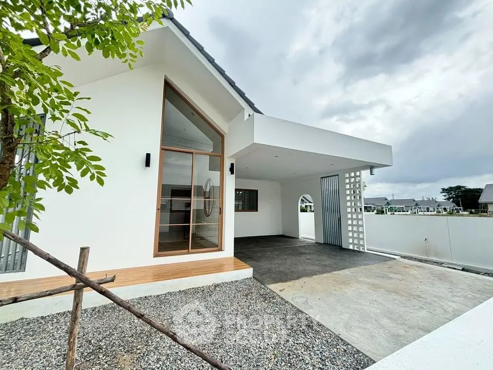 Modern minimalist house exterior with carport and large windows