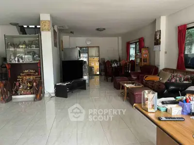 Spacious living room with elegant decor and open layout, perfect for family gatherings.