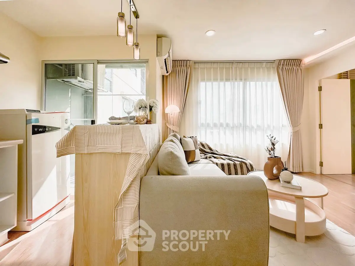 Bright and cozy living room with modern decor and large windows