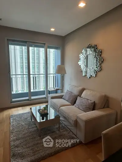 Stylish living room with modern decor and large windows for natural light.