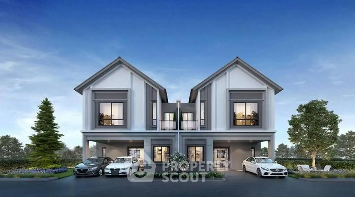 Modern duplex house with two-car garage and landscaped front yard