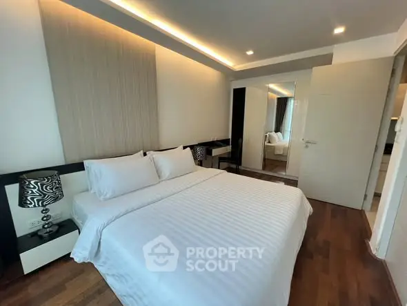 Luxurious modern bedroom with elegant decor and wooden flooring