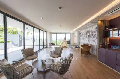 Spacious modern living room with large windows and stylish decor