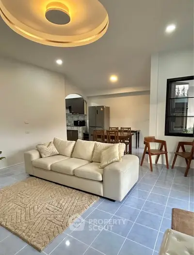 Spacious modern living room with open kitchen and stylish decor