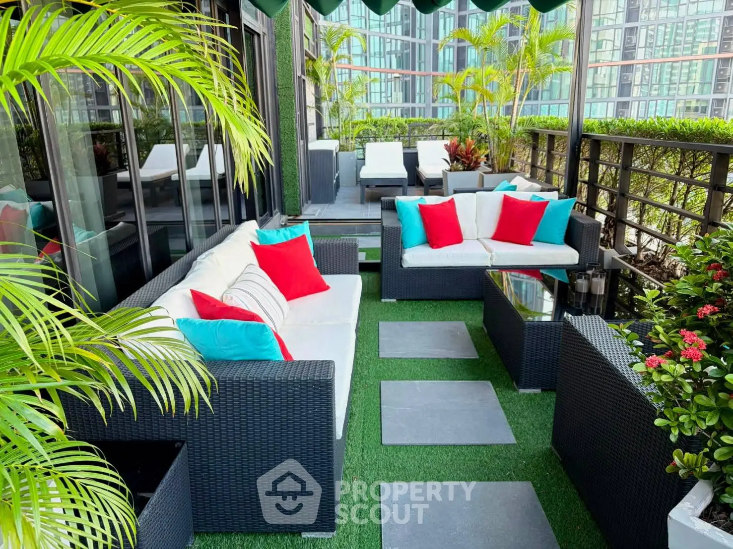 Luxurious rooftop terrace with stylish outdoor seating and lush greenery, perfect for relaxation and entertaining.