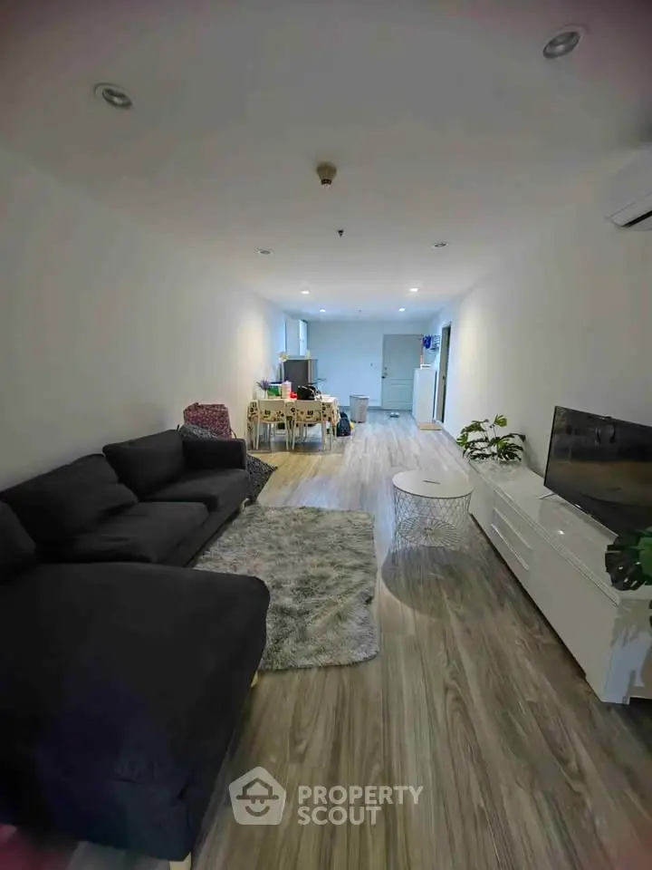 Spacious living room with modern decor and cozy seating area