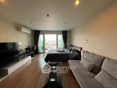 Spacious modern living room with balcony view in stylish apartment