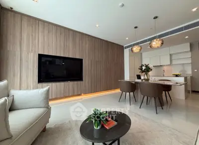 Modern open-plan living room with stylish kitchen and elegant decor