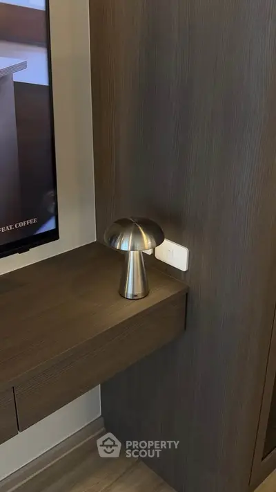 Modern interior with sleek wooden paneling and stylish lamp