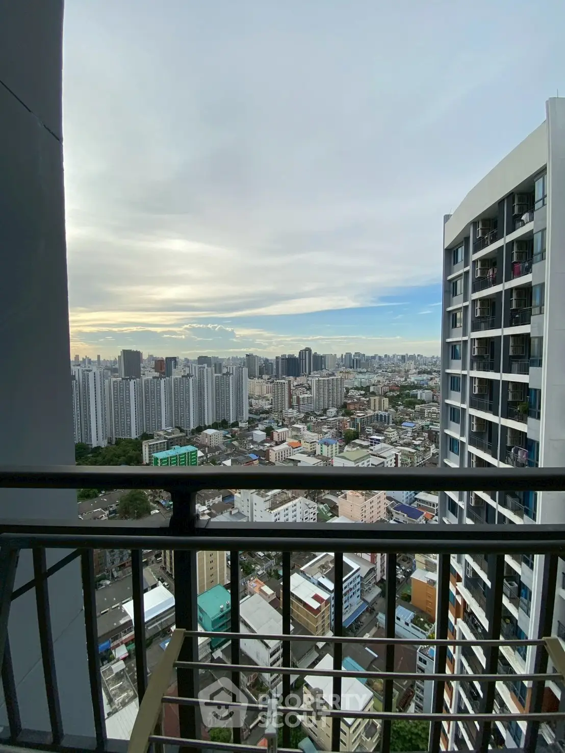 Stunning cityscape view from high-rise balcony with expansive skyline