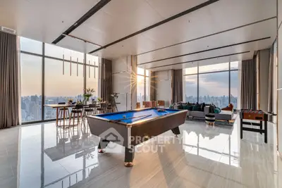 Luxurious penthouse with panoramic city views and entertainment area