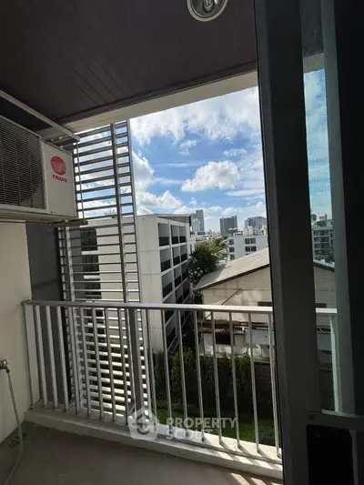 Modern balcony with city view and air conditioning unit