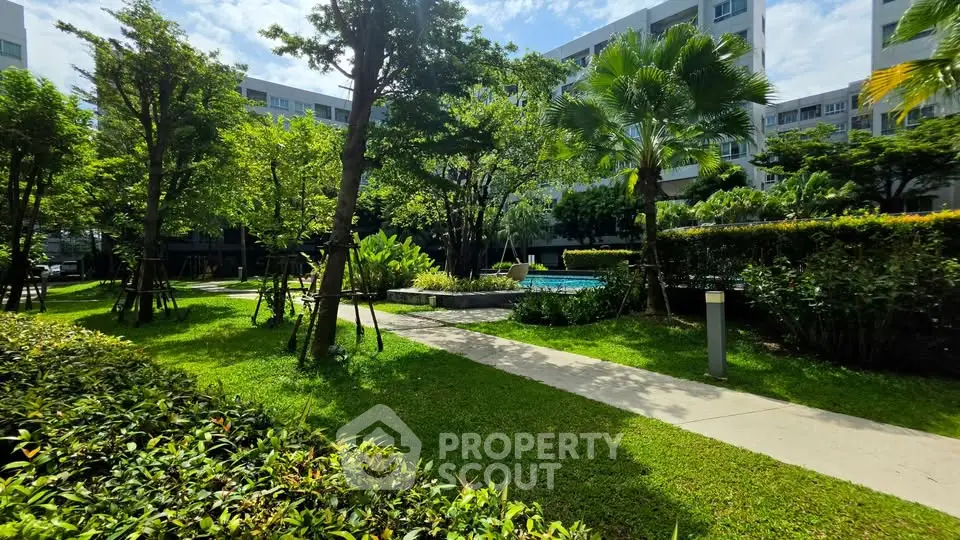 Lush garden view with pool in modern residential complex