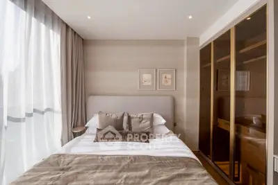 Luxurious bedroom with elegant decor and ample natural light