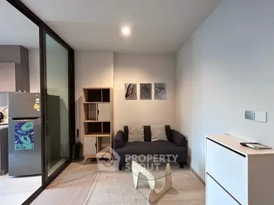 Cozy living room with modern furniture and glass partition