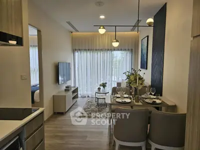 Modern open-plan living and dining area with stylish decor and natural light