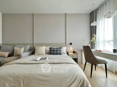 Modern bedroom with cozy bed, stylish decor, and natural light