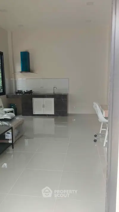 Modern kitchen with sleek design and gas stove in open layout