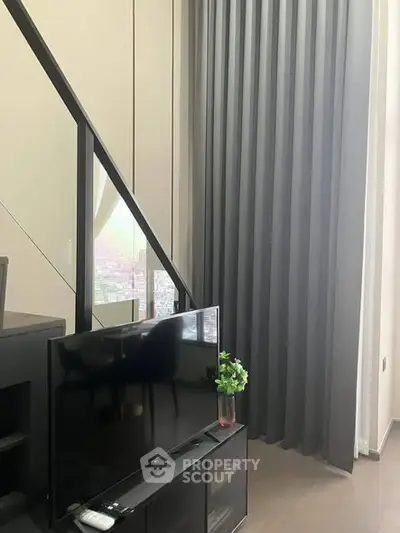 Modern living room with high ceilings and sleek decor