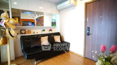 Stylish living room with modern decor and cozy seating in a contemporary apartment.
